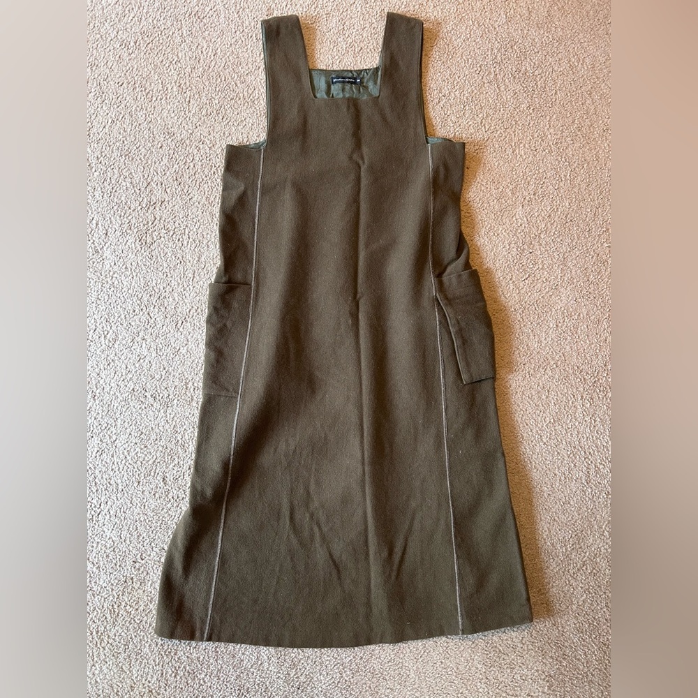 Wool jumper. Army green. 2 outer pockets. Brand is Gudrun Sjoden.